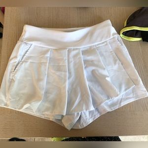White fabletics pleated tennis skort